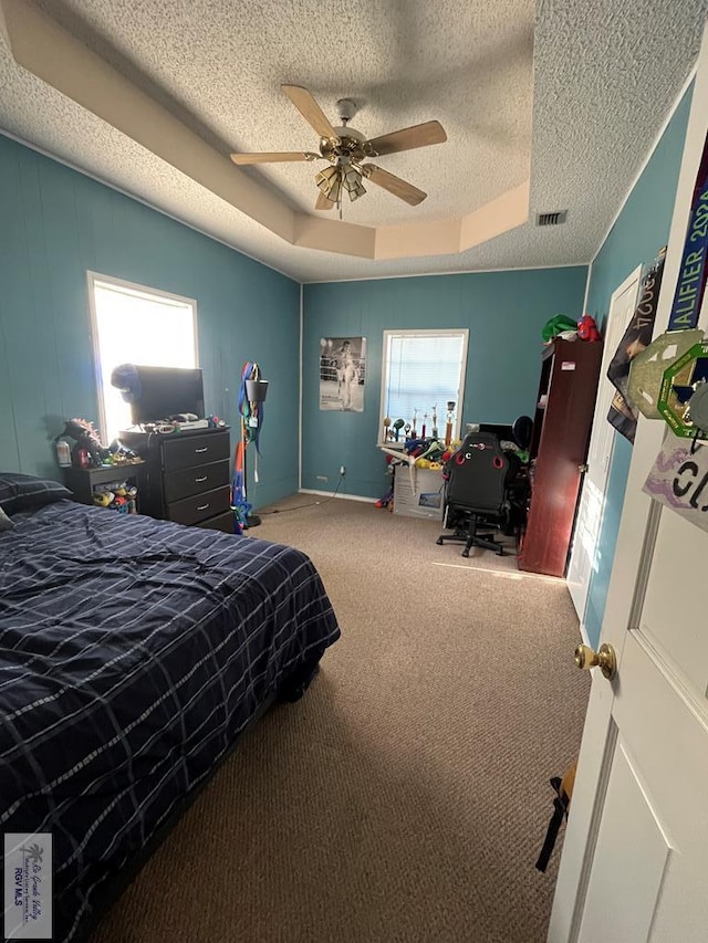 1822 Nasa, Brownsville, TX 78521 - carpeted bedroom featuring a textured ceiling, ceiling fan, a tray ceiling, and a desk