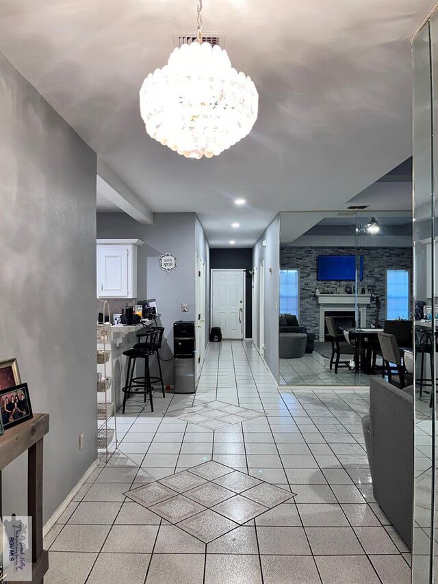 1822 Nasa, Brownsville, TX 78521 - hall with a chandelier, baseboards, and light tile patterned floors