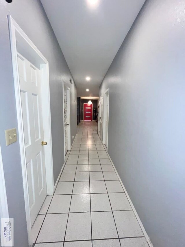 hallway with light tile patterned floors