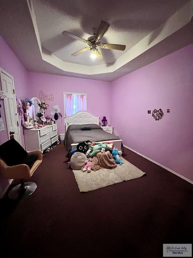 1822 Nasa, Brownsville, TX 78521 - bedroom with a raised ceiling, dark colored carpet, and ceiling fan
