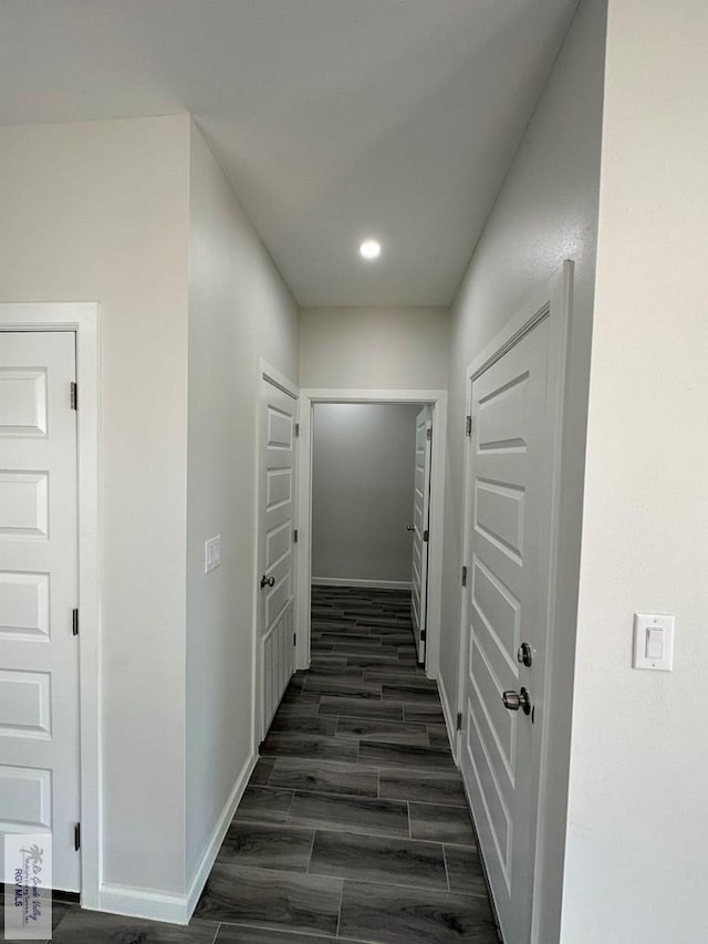 corridor featuring dark hardwood / wood-style floors