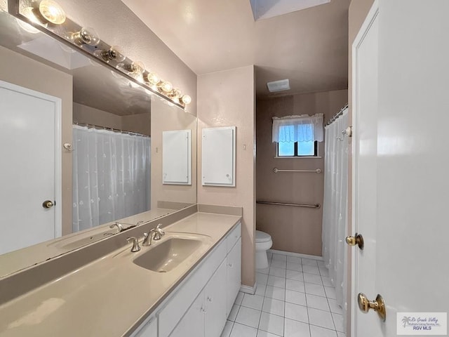 bathroom featuring tile patterned floors, vanity, a shower with shower curtain, and toilet