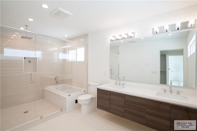 full bathroom featuring separate shower and tub, tile patterned floors, vanity, and toilet