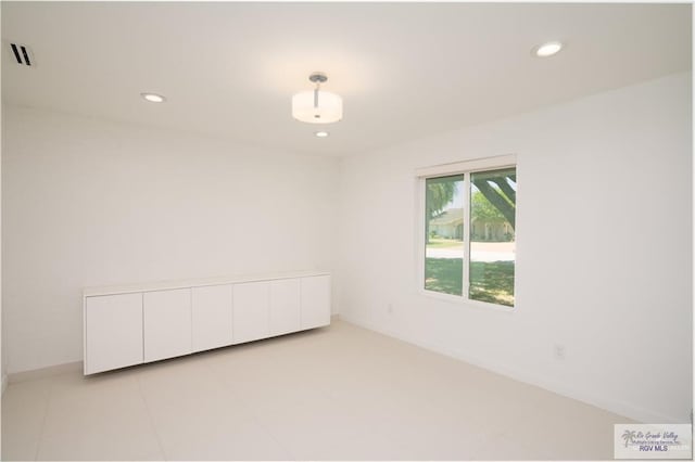 view of tiled spare room