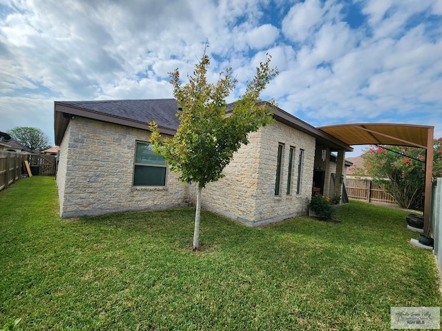 view of property exterior with a yard