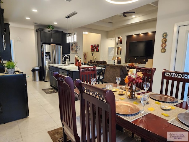 tiled dining space featuring sink