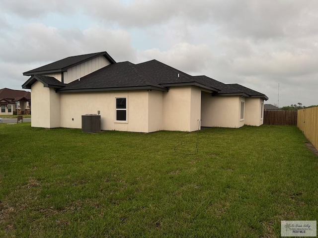 9464 S Queen Palm, Los Fresnos, TX 78566 - rear view of property with central air condition unit, a shingled roof, and stucco siding