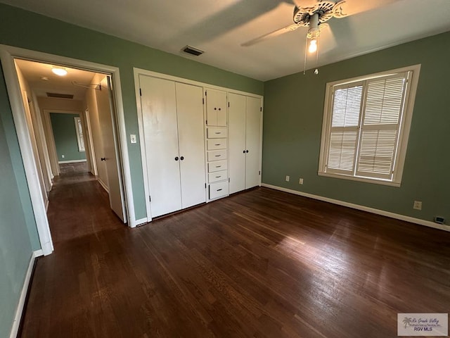 1406 E Bowie Ave, Harlingen, TX 78550 - unfurnished bedroom with baseboards, dark wood-style floors, a closet, and ceiling fan