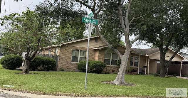 1406 E Bowie Ave, Harlingen, TX 78550 - view of front facade featuring brick siding