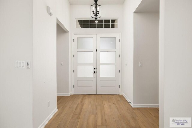 3515 S Elevation Dr, Edinburg, TX 78542 - foyer entrance with light wood-style floors and baseboards
