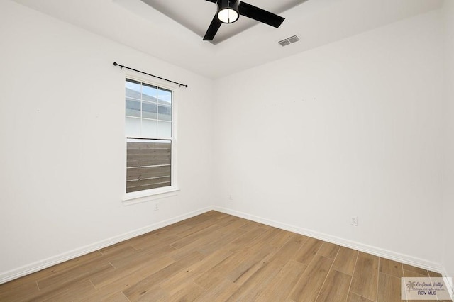 3515 S Elevation Dr, Edinburg, TX 78542 - empty room featuring wood finished floors, baseboards, and a ceiling fan