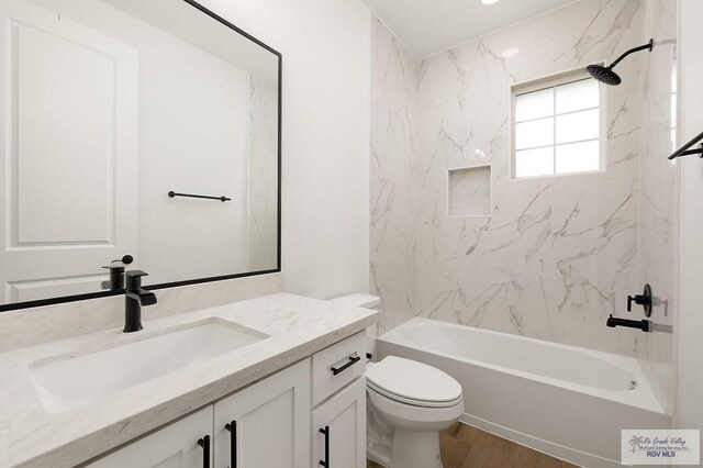 3515 S Elevation Dr, Edinburg, TX 78542 - bathroom with vanity, toilet,  shower combination, and wood finished floors