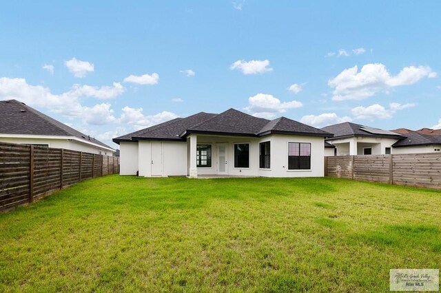 3515 S Elevation Dr, Edinburg, TX 78542 - rear view of house featuring stucco siding and roof with shingles
