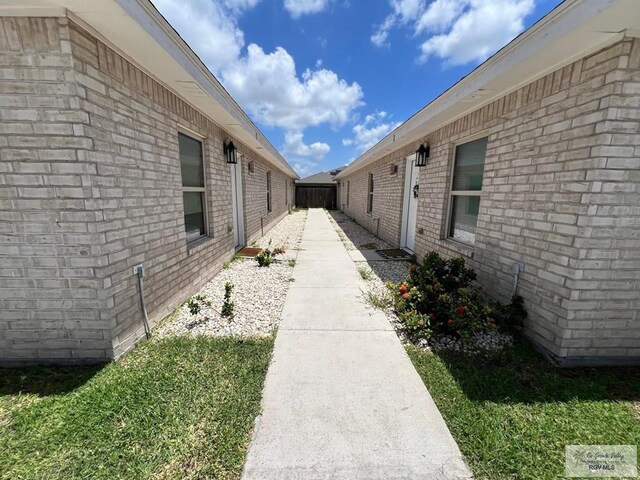 view of property exterior with a yard