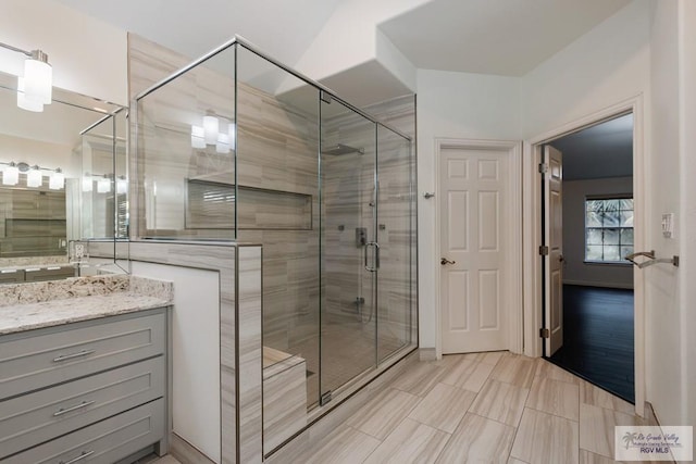 bathroom featuring vanity and walk in shower