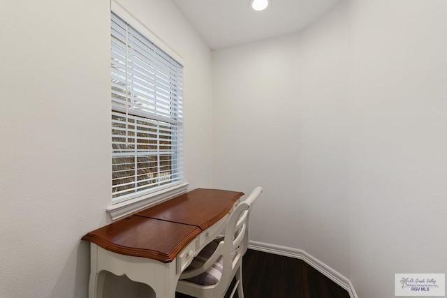 unfurnished office featuring hardwood / wood-style flooring