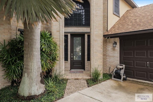 property entrance with a garage