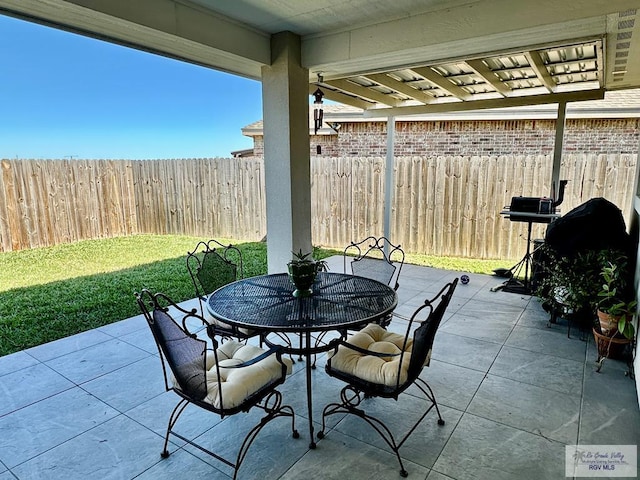 view of patio / terrace with fence and outdoor dining space