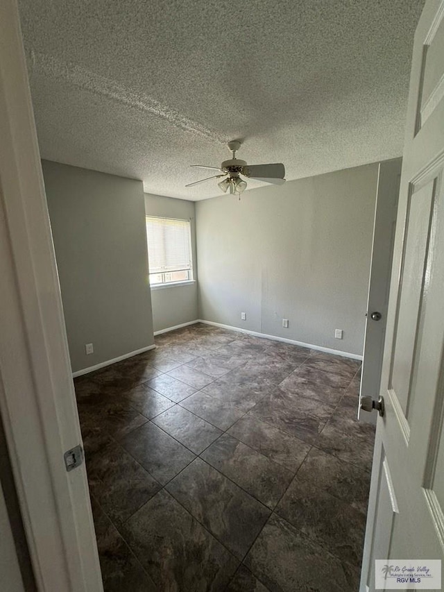 unfurnished room featuring a textured ceiling and ceiling fan