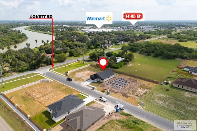 1209 Bridle Way, San Benito, TX 78586 - bird's eye view of a large body of water and a tree filled landscape