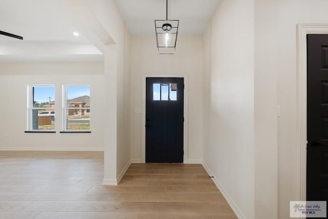 1209 Bridle Way, San Benito, TX 78586 - foyer entrance with light wood-type flooring and baseboards