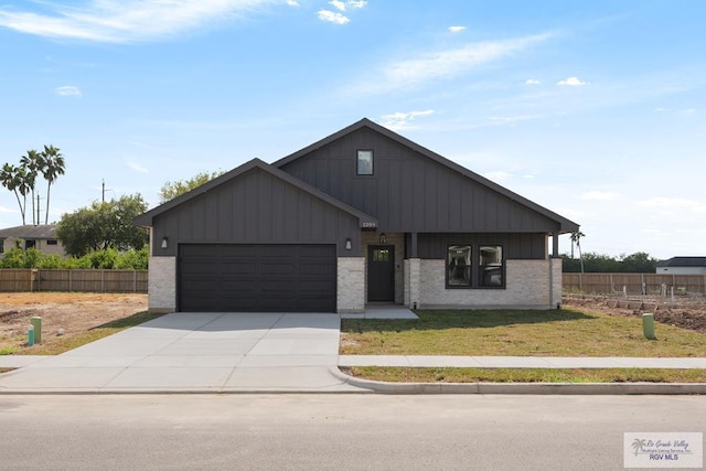 1209 Bridle Way, San Benito, TX 78586 - view of front of house featuring an attached garage, board and batten siding, concrete driveway, and brick siding
