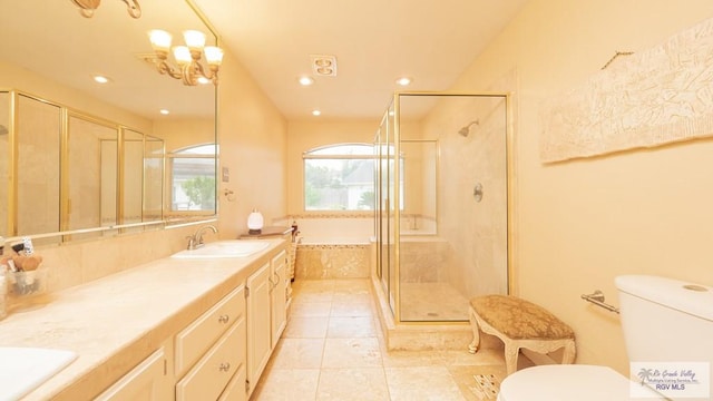 full bathroom with tile patterned flooring, vanity, toilet, and independent shower and bath