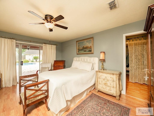 bedroom with access to exterior, ceiling fan, and hardwood / wood-style floors