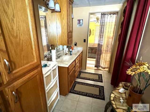 bathroom with vanity, tile patterned floors, and ceiling fan