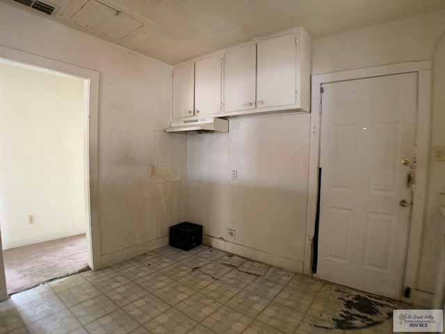 interior space featuring light floors and visible vents