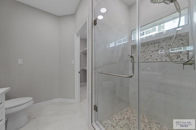 32722 Jorge St, Los Fresnos, TX 78566 - full bath with a stall shower, vanity, a spacious closet, and marble finish flooring