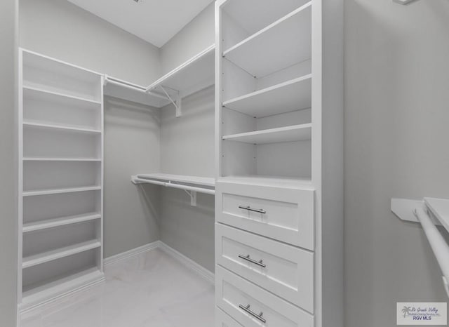 32722 Jorge St, Los Fresnos, TX 78566 - spacious closet featuring light marble finish flooring