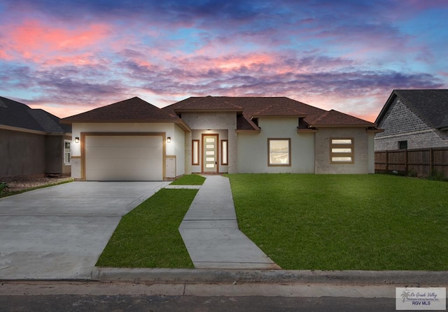 32722 Jorge St, Los Fresnos, TX 78566 - view of front of property featuring a garage, stucco siding, driveway, and a shingled roof