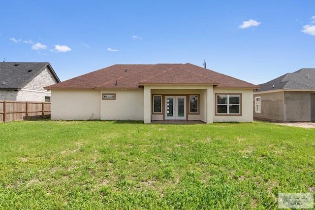 32722 Jorge St, Los Fresnos, TX 78566 - rear view of house featuring french doors, stucco siding, and roof with shingles