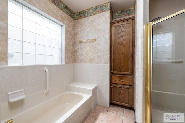 1810 N Shore Dr, Port Isabel, TX 78578 - full bath with wallpapered walls, a garden tub, a stall shower, tile patterned flooring, and tile walls