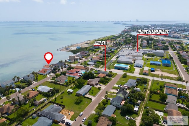 1810 N Shore Dr, Port Isabel, TX 78578 - aerial overview of property's location featuring a nearby body of water and nearby suburban area