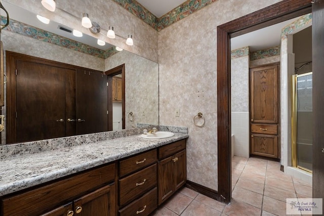 1810 N Shore Dr, Port Isabel, TX 78578 - bathroom with vanity, tile patterned floors, and a stall shower