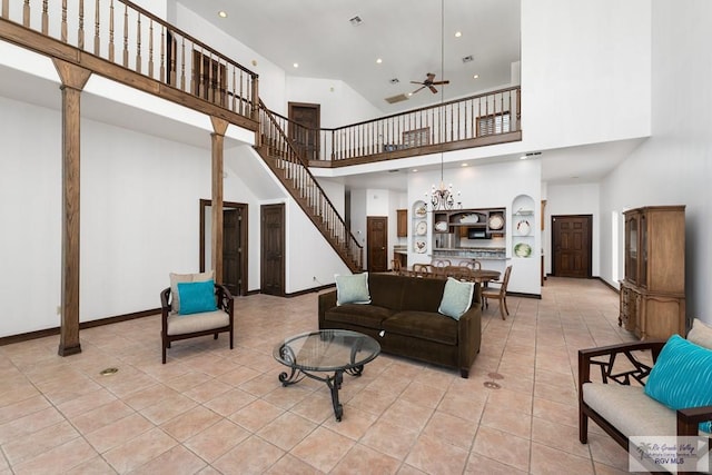 1810 N Shore Dr, Port Isabel, TX 78578 - living area featuring a high ceiling, light tile patterned floors, ceiling fan, stairway, and recessed lighting