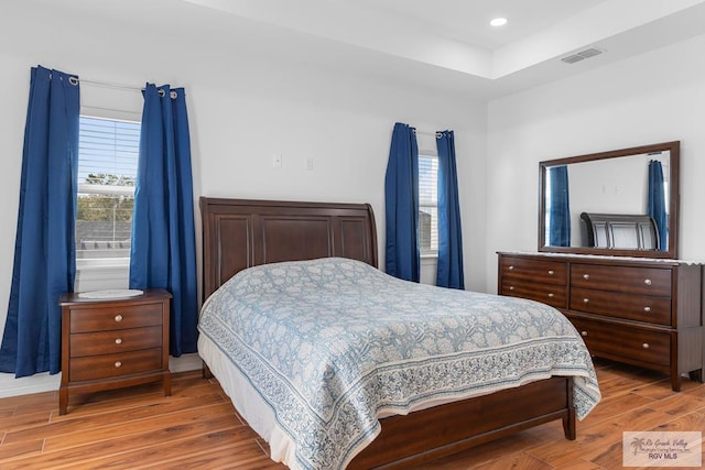 bedroom with hardwood / wood-style floors