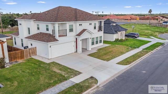 view of front of property with a front yard and a garage