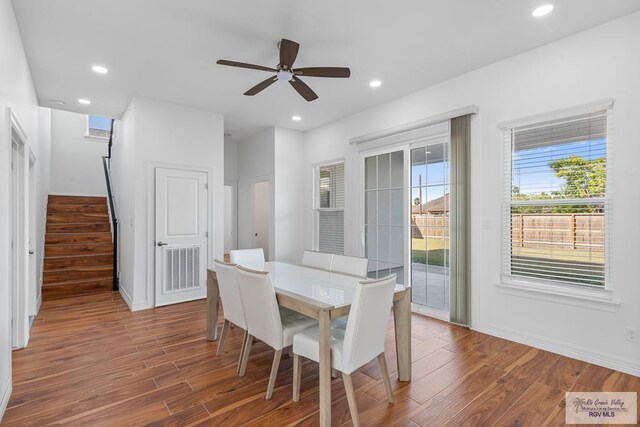 dining room with wood-type flooring and ceiling fan