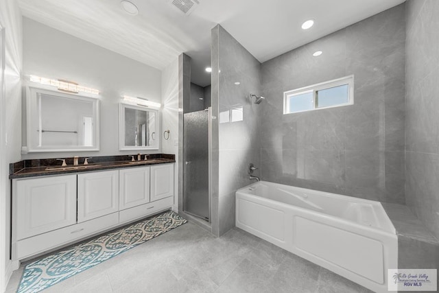 bathroom with separate shower and tub and vanity