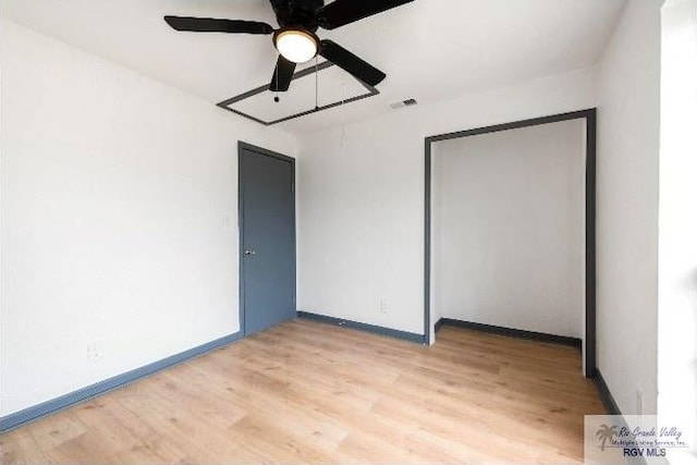 unfurnished bedroom with ceiling fan and light hardwood / wood-style floors