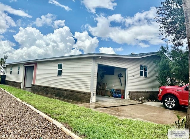 view of side of home featuring a garage