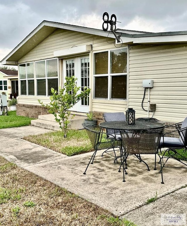 back of house featuring french doors and a patio area