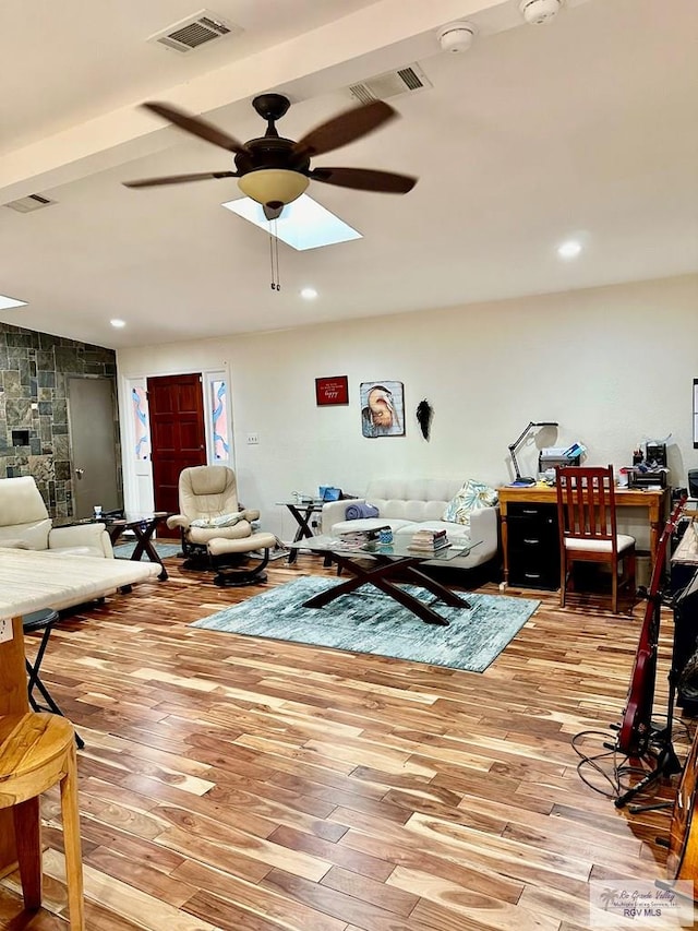 living room featuring ceiling fan and light wood-type flooring