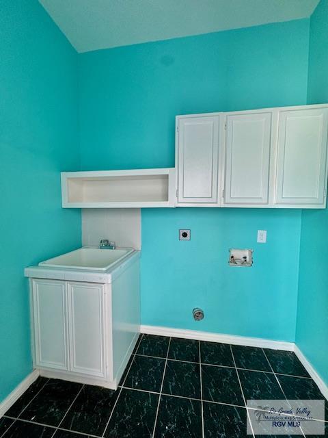 washroom featuring electric dryer hookup, cabinets, and hookup for a washing machine