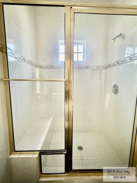 bathroom featuring an enclosed shower