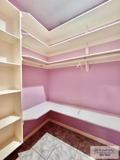 walk in closet featuring tile patterned floors