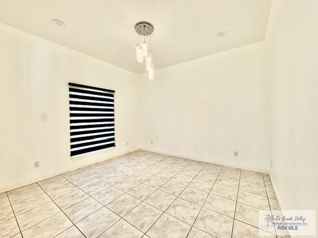 view of tiled spare room